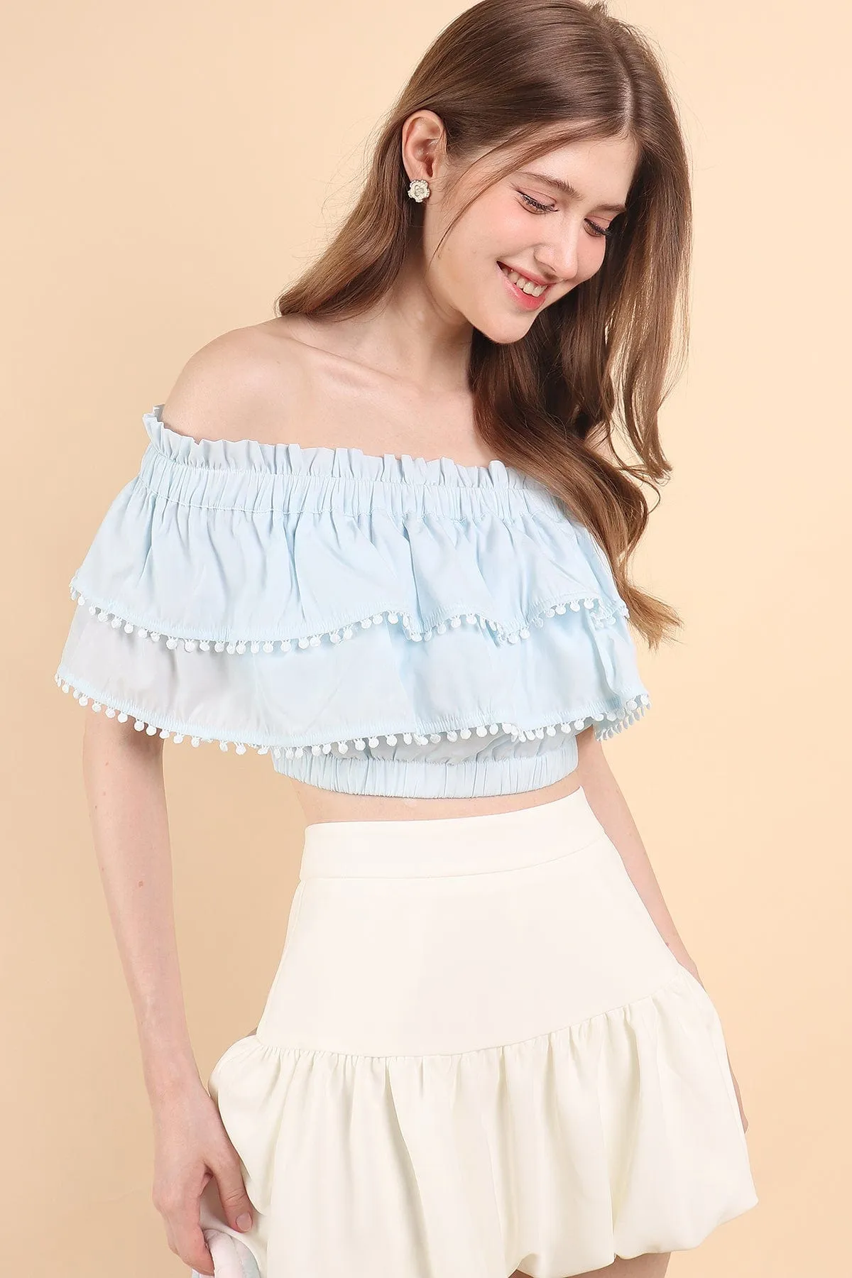 LINDSAY POM POM OFFSIE TOP IN BLUE