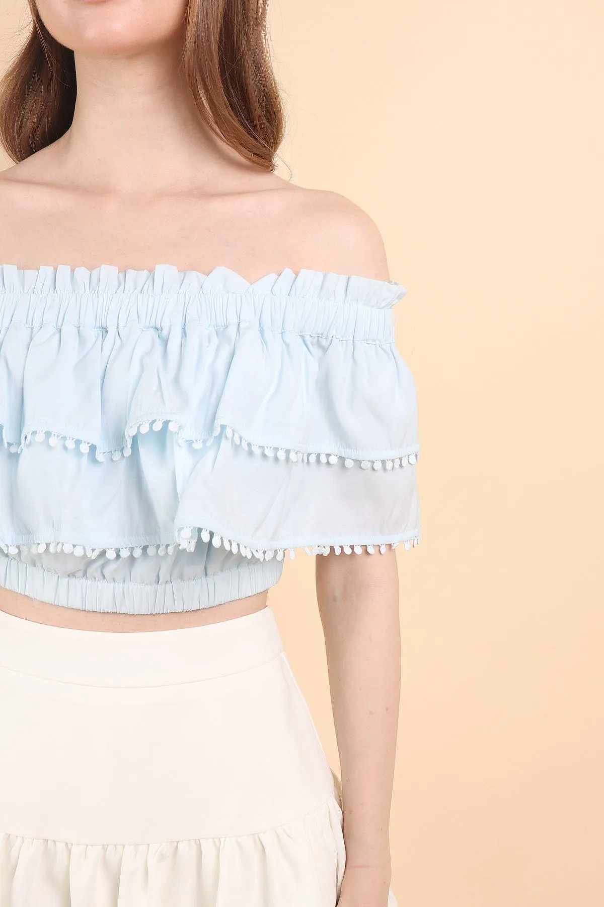 LINDSAY POM POM OFFSIE TOP IN BLUE