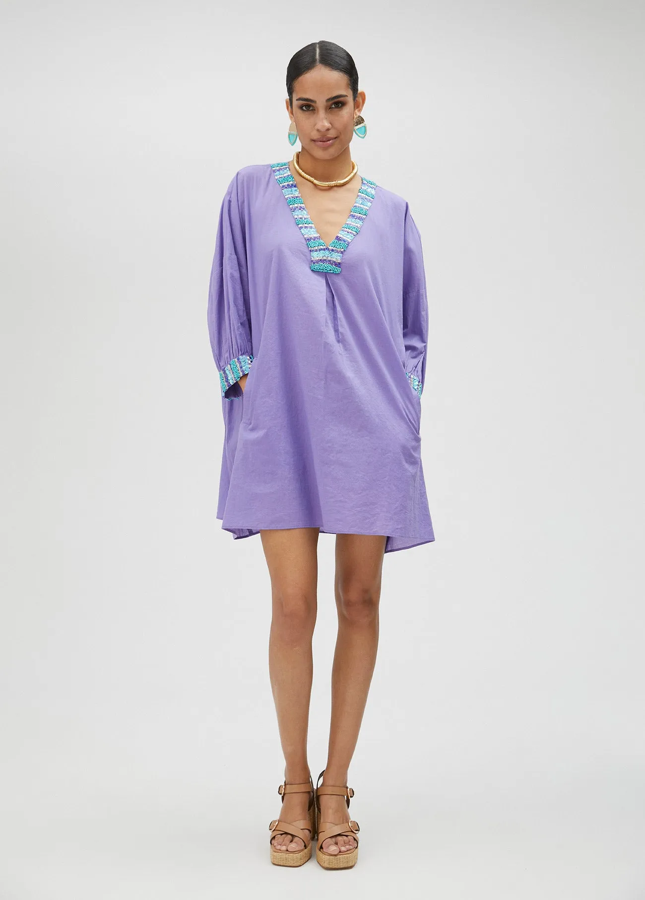 V-neck blouse with neckline and cuff details